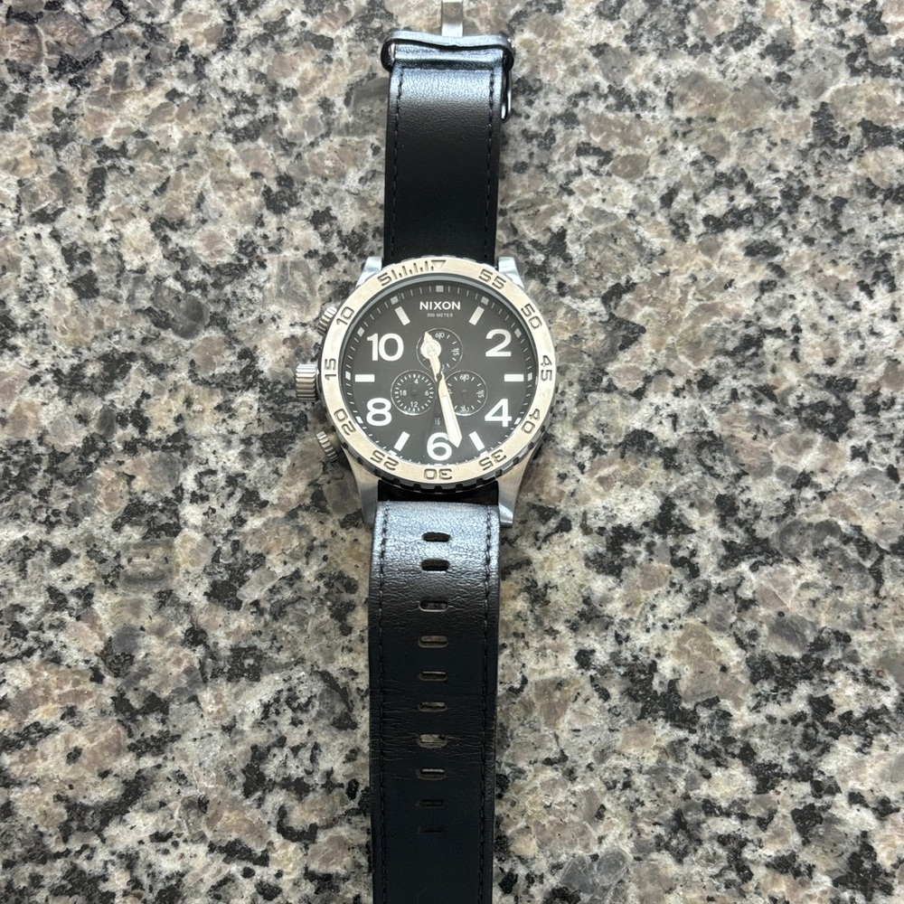 Nixon Black and Silver Watch with Leather Band